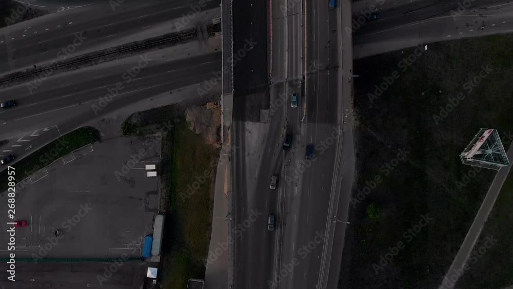 Bridge road aerial top view with truck and car passing buy during sunset Golden Hour in Riga, Latvia Spring 2019