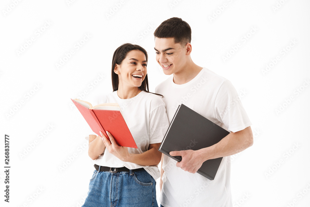 Attractive young couple standing isolated over white Attractive young couple standing isolated over white