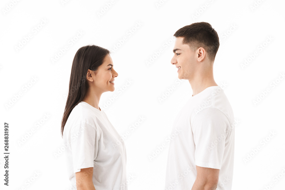 Attractive young couple standing isolated over white Attractive young couple standing isolated over white
