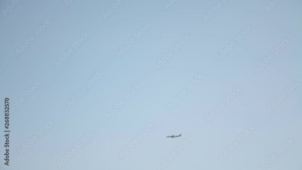 Passenger plane landing at airport with beautiful blue sky Passenger plane landing at airport with beautiful blue sky