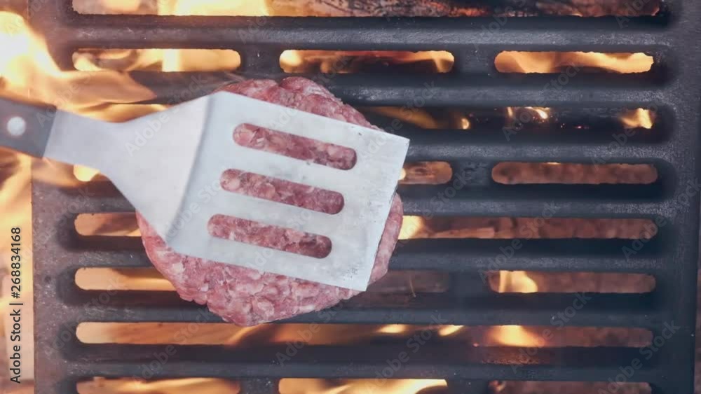 Cooking hamburger. Beef or pork cutlet grilling on grid. Cook man ...