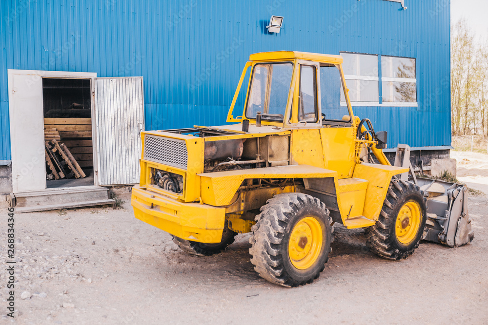 Heavy machine with bucket - tractor loader or excavator Heavy machine with bucket - tractor loader or excavator