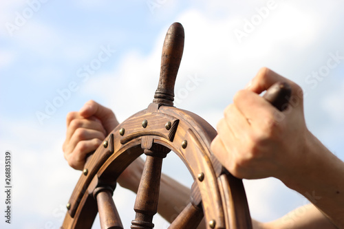 Steering hand wheel ship on sky background