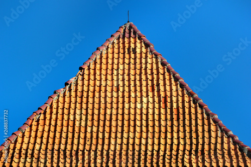Red tiled pyramidal roof of a tower