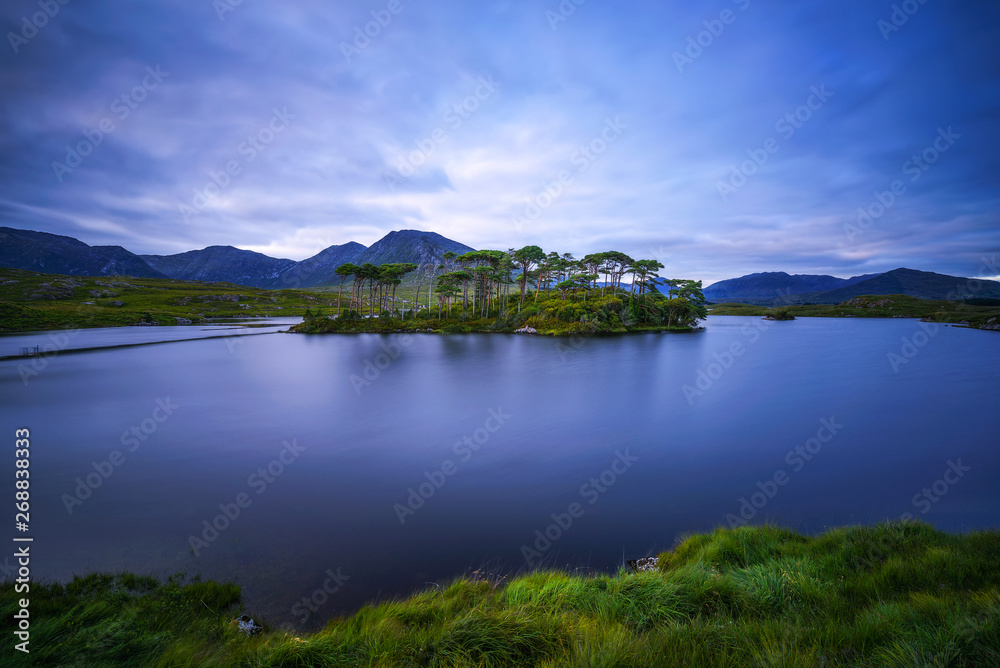 Pine Trees Island in the Derryclare Lake at sunset