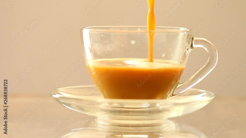 Man making a cup of tea, close up in studio Man making a cup of tea, close up in studio