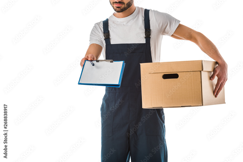 partial view of delivery man with cardboard box holding clipboard with blank paper isolated on white partial view of delivery man with cardboard box holding clipboard with blank paper isolated on white