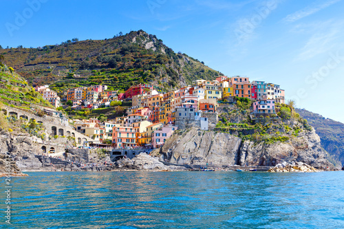 Manarola, Liguria, Italy fisherman village, colorful houses on sunny warm day. Monterosso al Mare, Vernazza, Corniglia, Manarola and Riomaggiore, Cinque Terre National Park UNESCO World Heritage photo