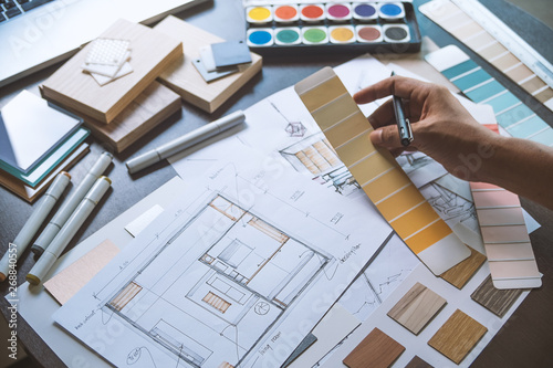 Architect designer Interior creative working hand drawing sketch plan blue print selection material color samples art tools Design Studio