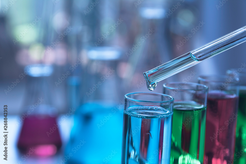 Glass laboratory chemical test tubes with liquid for analytical , medical, pharmaceutical and scientific research concept. Glass laboratory chemical test tubes with liquid for analytical , medical, pharmaceutical and scientific research concept.