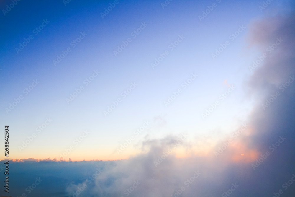 Fototapeta premium Sunset in sky and cloud, beautiful colorful twilight time with silhouette of mountain.