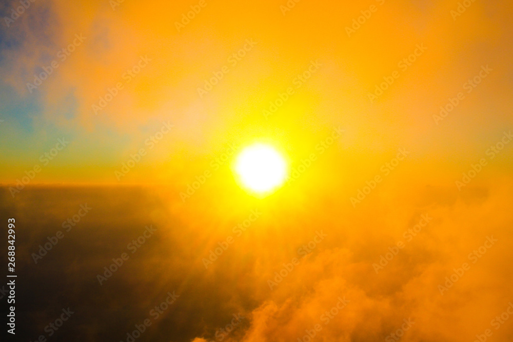 Naklejka premium Golden light in Forested and mountain with sunrise in morning mist.Fog cover the jungle hill in Thailand