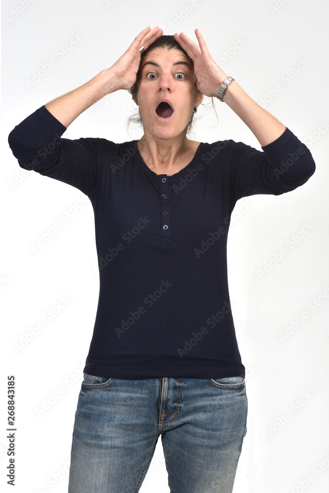 woman with expression of forgetfulness or surprise on white background woman with expression of forgetfulness or surprise on white background
