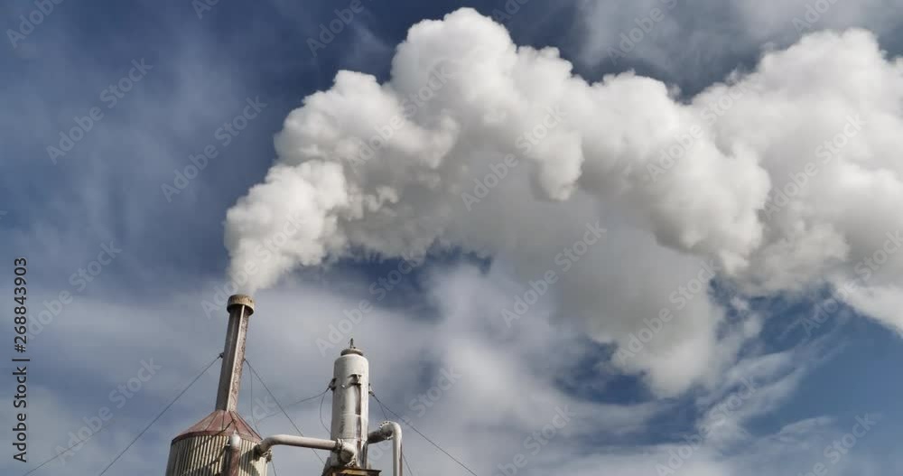 Geothermal steam billowing from pipe on Icelandic farm blue sky.mov Geothermal steam billowing from pipe on Icelandic farm blue sky.mov