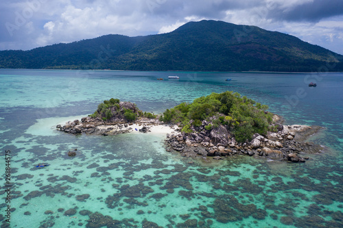 Aerial drone view of amazing tropical paradise Koh Kra island with white empty beach during sunny summer day, Thailand