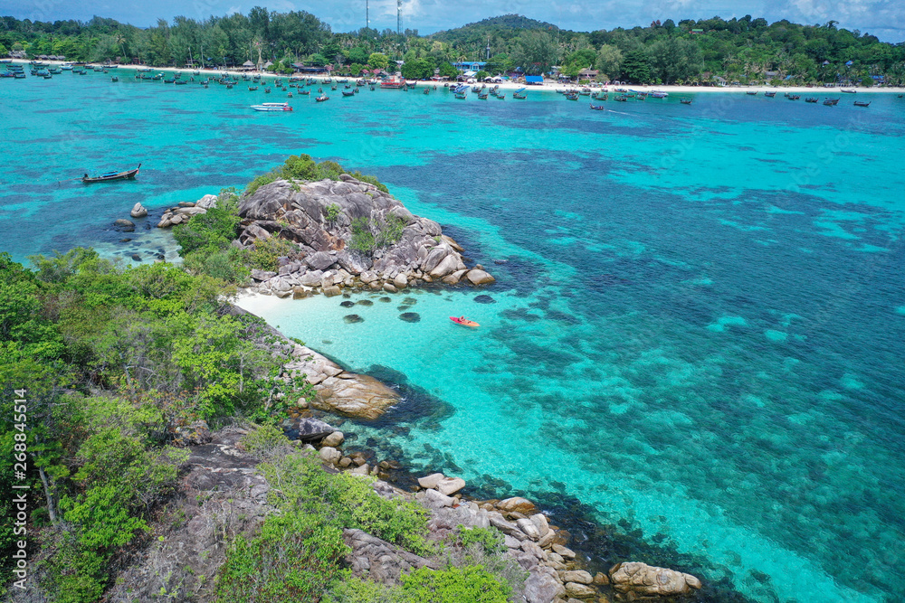 Fototapeta premium Aerial drone view of amazing tropical paradise Koh Kra island with white empty beach during sunny summer day, Thailand