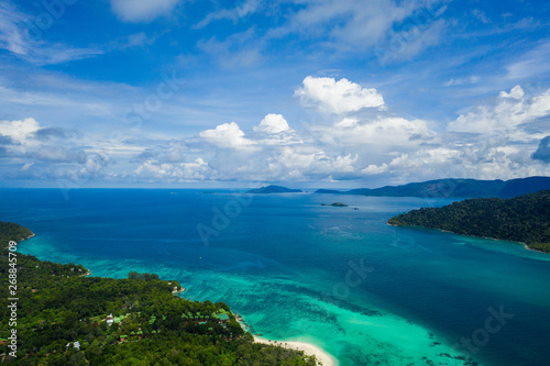 Aerial drone view of beautiful green Koh Usen island with amazing lagoon sea over summer sky background, Thailand