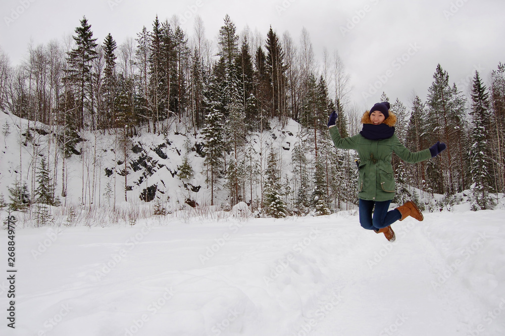 Asian woman at winter forest