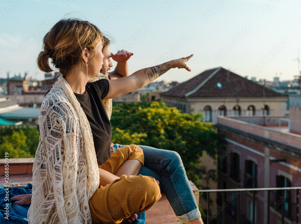 Relaxing man and woman sitting on terrace