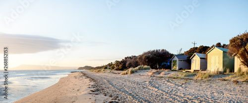 Wide angle panorama of coastal beach huts in Australia
