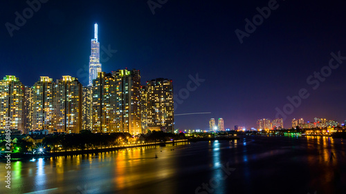 Ho Chi Minh City  Vietnam - May 7  2019   Riverside City at nightclouds in the sky at end of day brighter coal sparkling skyscrapers along beautiful river in Ho Chi Minh City  Vietnam - Image