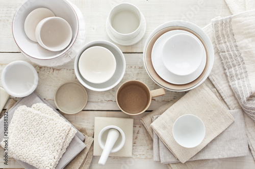 Various dishes on white wood surface