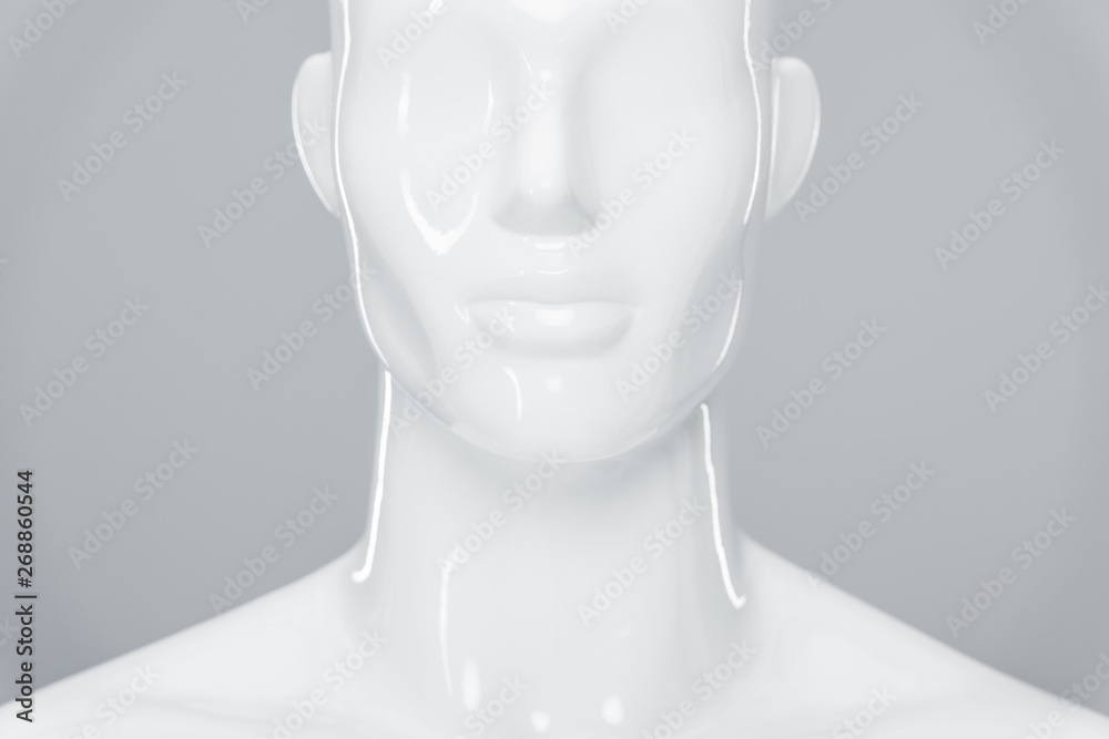 white plastic mannequin figure isolated on grey white plastic mannequin figure isolated on grey