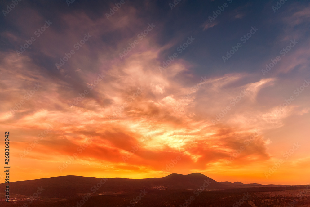 stunning sunrise in the mountains in orange tones