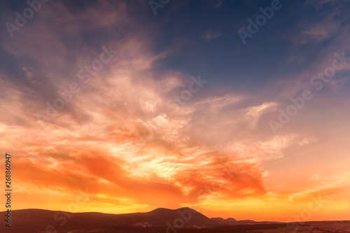stunning sunrise in the mountains in orange tones