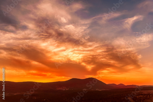 stunning sunrise in the mountains in orange tones