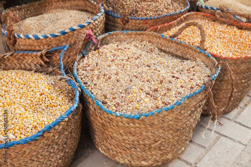 Dry corn and grains lie in baskets © evannovostro