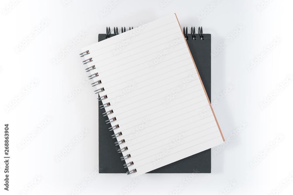 school notebook on a blue background, spiral notepad on a table school notebook on a blue background, spiral notepad on a table