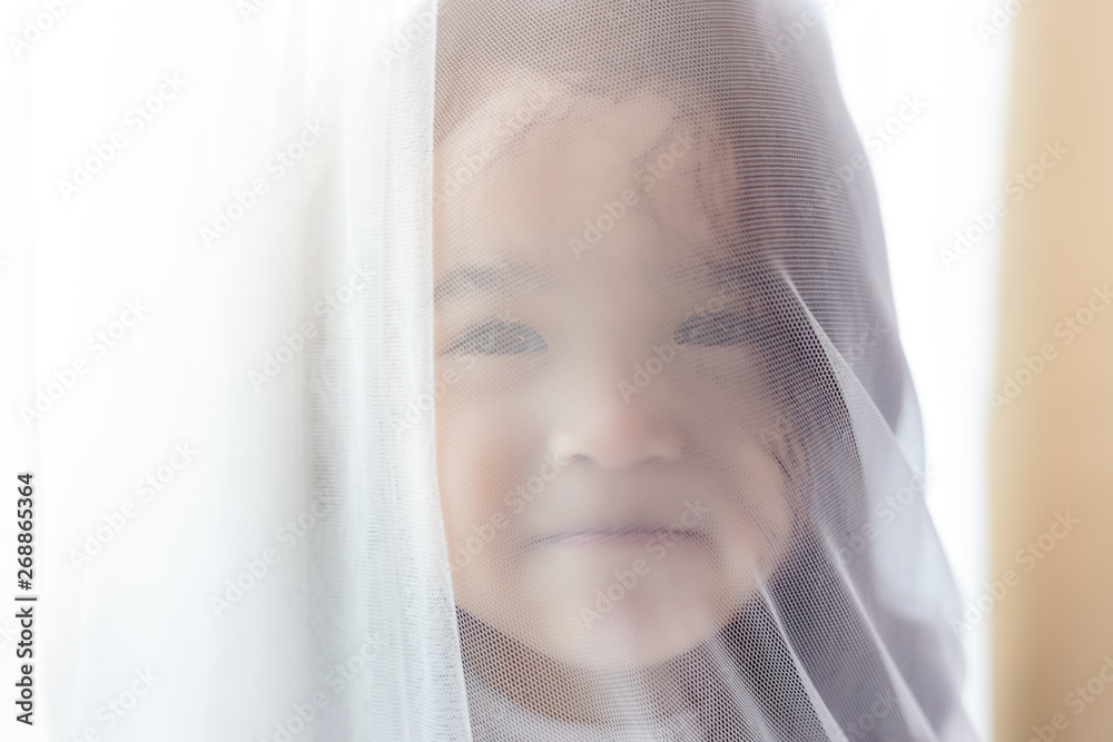 Portrait little cute girl. Attractive beautiful little child hiding behind curtain at house. Nursery child looks so lovely and innocent. She get happiness. Charming beautiful little girl is only child Portrait little cute girl. Attractive beautiful little child hiding behind curtain at house. Nursery child looks so lovely and innocent. She get happiness. Charming beautiful little girl is only child