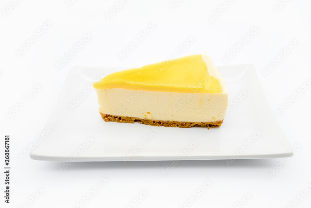 Lemon cheesecake on the plate isolate on white background