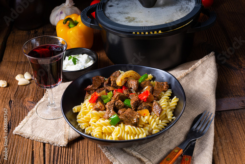 Fussili noodle with klaschise spicy goulash and paprika photo