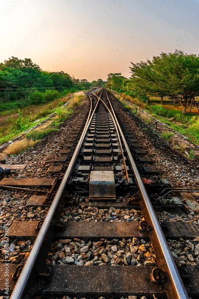 Railroad and railway train transportation with color of sky sunlight