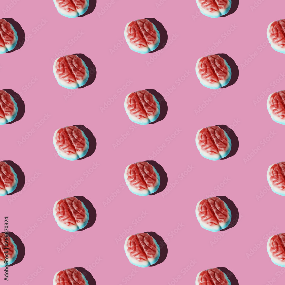 Brain candy arranged in a pattern on a pink background Brain candy arranged in a pattern on a pink background