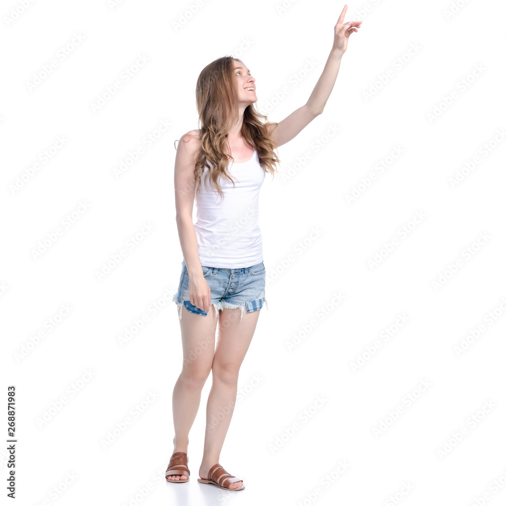 Woman in denim shorts showing pointing on white background isolation
