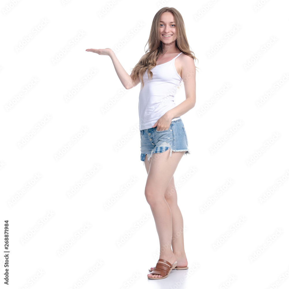 Woman in denim shorts showing pointing on white background isolation Woman in denim shorts showing pointing on white background isolation
