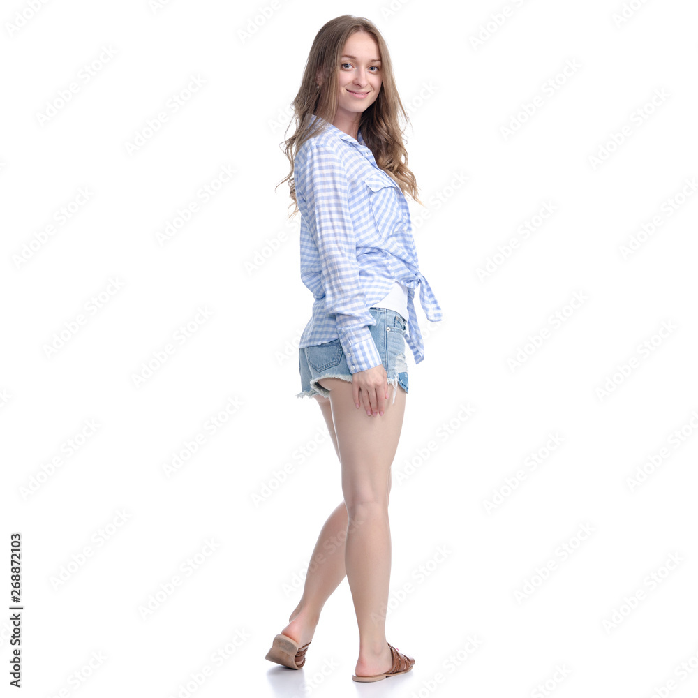 Woman in denim shorts standing smiling positive emotions on white background isolation Woman in denim shorts standing smiling positive emotions on white background isolation