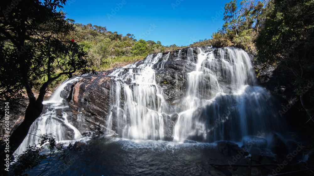 Obraz premium small wide waterfall in forest