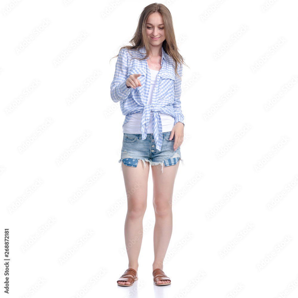 Woman in denim shorts showing pointing on white background isolation Woman in denim shorts showing pointing on white background isolation