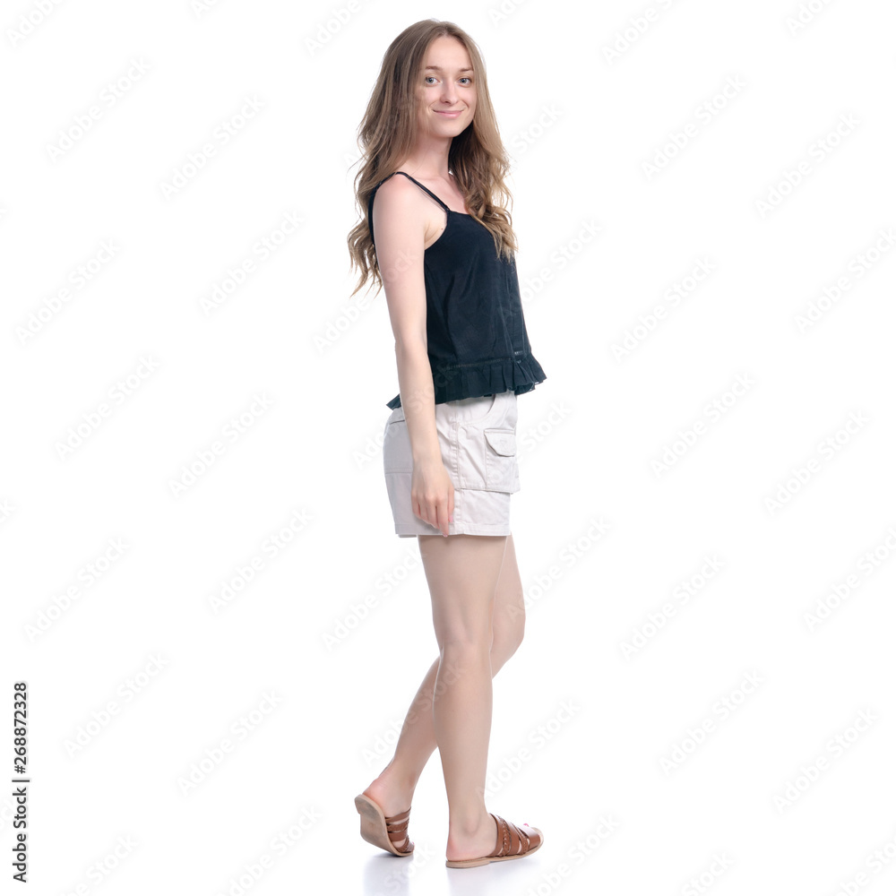 Woman in shorts standing smiling positive emotions on white background isolation Woman in shorts standing smiling positive emotions on white background isolation