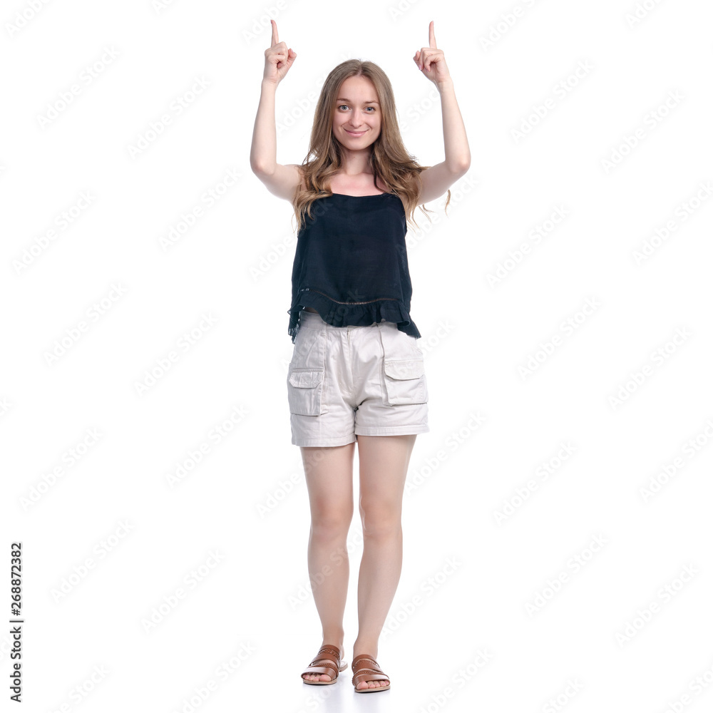 Woman in shorts showing pointing on white background isolation Woman in shorts showing pointing on white background isolation