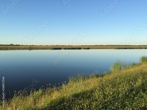 landscape with lake and blue sky