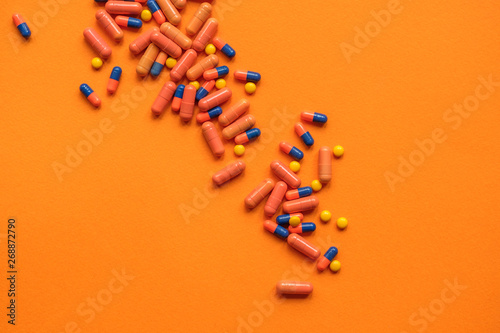 Orange Pills On Orange Background