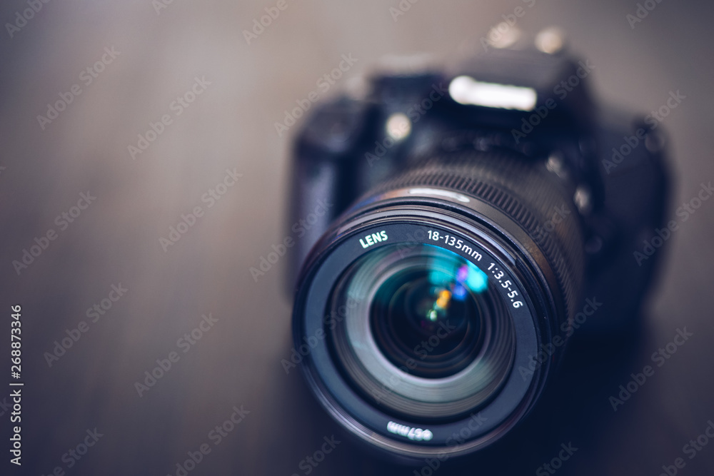 DSLR camera isolated on a black background. Black DSLR Camera isolated.  Photo Camera or Video lens close-up on black background DSLR objective  Stock Photo | Adobe Stock