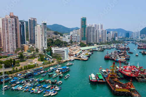  Drone fly over Hong Kong fishing harbor port © leungchopan