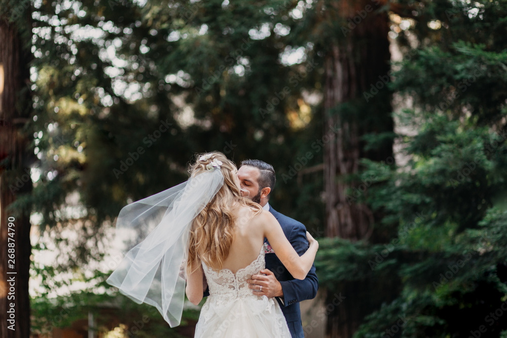 Wedding Couple Dancing in the Forest and Kissing Wedding Couple Dancing in the Forest and Kissing