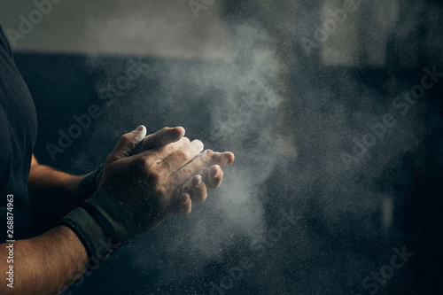 Hands with chalk ready for exercising.